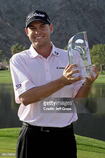 Bill Haas poses with the trophy after winning the Bob Hope Classic at the Palmer Private Course at PGA West on January 25, 2010 in La Quinta,...