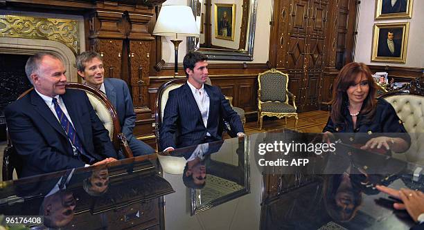 Argentina's President Cristina Fernandez de Kirchner meets with Argentinian driver Jose Maria Lopez and Sporting Director of the US F1 Team Peter...