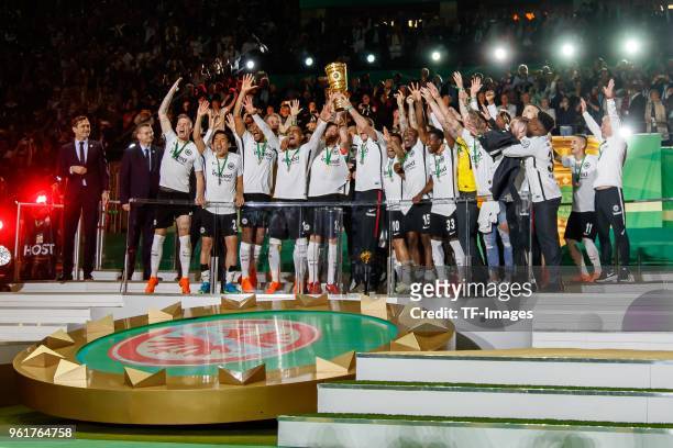 Players of Eintracht Frankfurt celebrate with the trophy after winning the DFB Cup final between Bayern Muenchen and Eintracht Frankfurt at...
