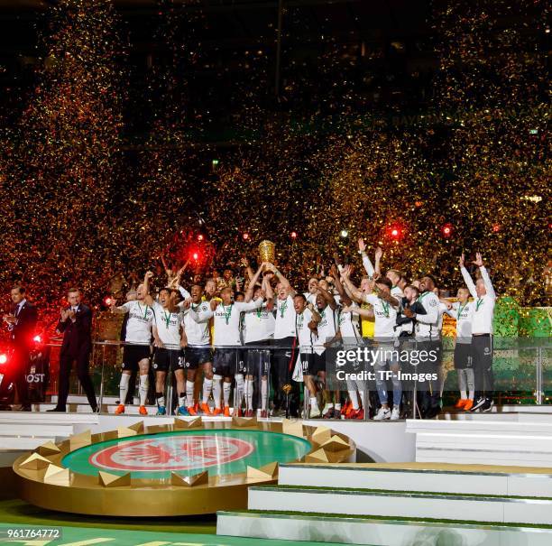 Players of Eintracht Frankfurt celebrate with the trophy after winning the DFB Cup final between Bayern Muenchen and Eintracht Frankfurt at...