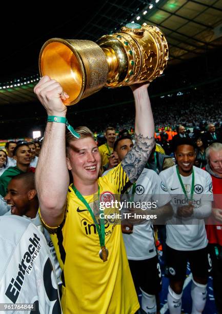 Goalkeeper Leon Baetge of Frankfurt celebrates with the trophy after winning the DFB Cup final between Bayern Muenchen and Eintracht Frankfurt at...