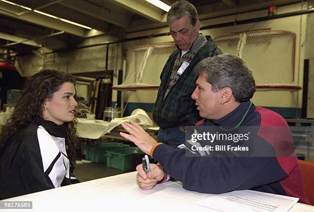 Christmas On Ice: Nancy Kerrigan with her father Dan Kerrigan and agent Jerry Solomon backstage after exhibition at Cumberland County Civic Center....