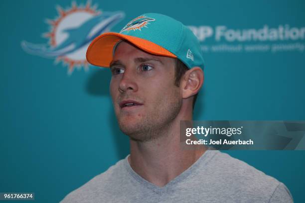 Ryan Tannehill of the Miami Dolphins talks to the media after the teams training camp on May 23, 2018 at the Miami Dolphins training facility in...