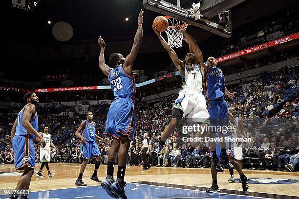 Ramon Sessions of the Minnesota Timberwolves goes to the basket against Jeff Green and Eric Maynor of the Oklahoma City Thunder during the game on...