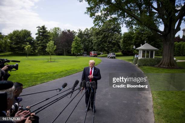 President Donald Trump pauses while speaking to members of the media before departing for New York on the South Lawn of the White House in...