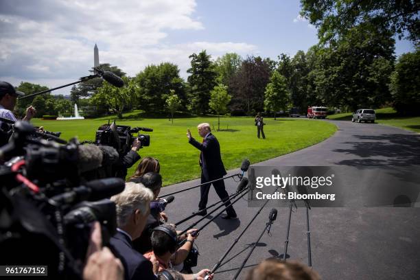 President Donald Trump waves to members of the media before departing for New York on the South Lawn of the White House in Washington, D.C., on...