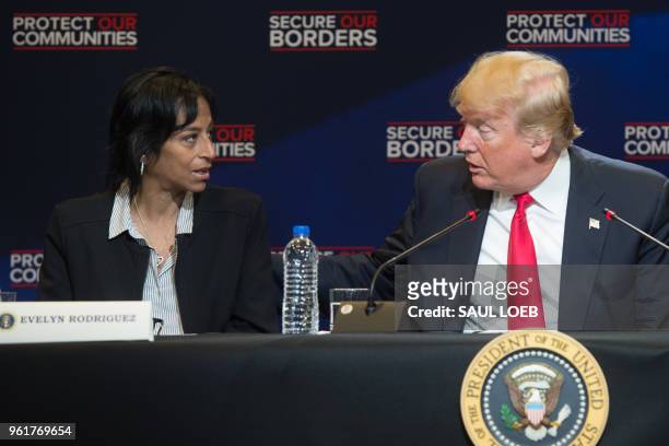President Donald Trump speaks alongside Evelyn Rodriguez , whose daughter was killed by MS-13 gang members, during a roundtable discussion on...