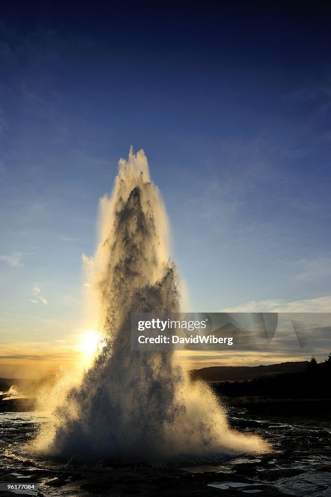 Geyser Strokkur, Iceland erupting hot water & steam spraying high