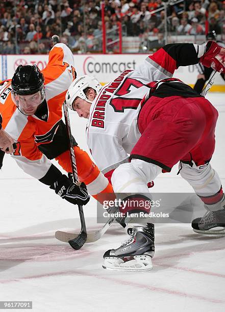 Jeff Carter of the Philadelphia Flyers and Rod Brind'Amour of the Carolina Hurricanes readies for the drop of the puck on a face-off on January 23,...