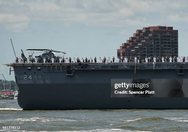 The Norfolk-based USS Arlington joins the Parade of Ships as it makes its way past the Statue of Liberty on the opening day of Fleet Week on May 23,...