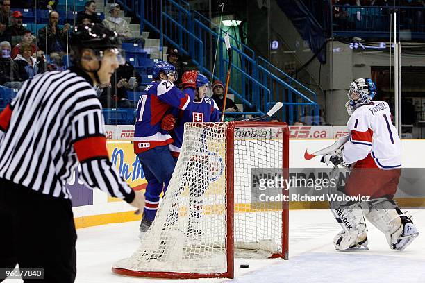 Samuel Mlynarovic and Andrej Stastny of Team Slovakia celebrate a goal during the 2010 IIHF World Junior Championship Tournament Relegation game...