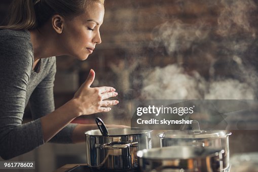 Smelling Delicious Beautiful Woman Smelling Delicious Lunch She Is Preparing In The ...