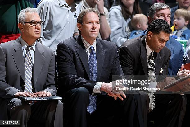 Assistant coach Dave Wohl, head coach Kurt Rambis and assistant coach Reggie Theus of the Minnesota Timberwolves look on from the bench during the...