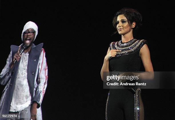 British singer Cheryl Cole performs on stage with a hologram of will.i.am of the Black Eyed Peas during the DLD Starnight at Haus der Kunst on...