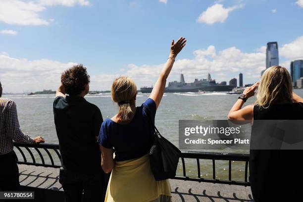 The Norfolk-based USS Arlington joins the Parade of Ships as it makes its way past the Statue of Liberty on the opening day of Fleet Week on May 23,...