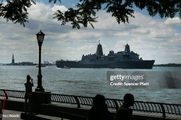 The Norfolk-based USS Arlington joins the Parade of Ships as it makes its way past the Statue of Liberty on the opening day of Fleet Week on May 23,...