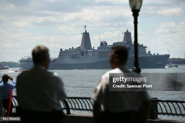 The Norfolk-based USS Arlington joins the Parade of Ships as it makes its way past the Statue of Liberty on the opening day of Fleet Week on May 23,...