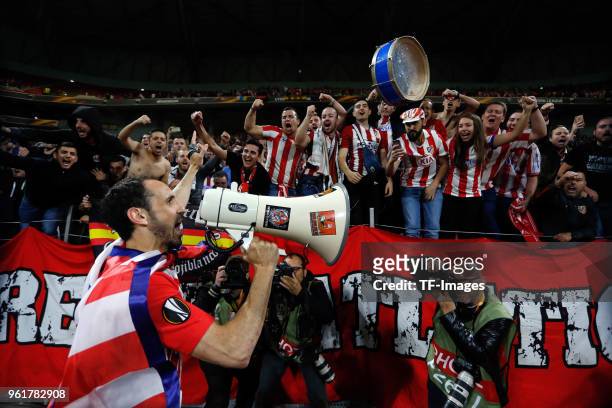 Juanfran of Atletico Madrid celebrates with fans after winning the UEFA Europa League Final between Olympique de Marseille and Club Atletico de...