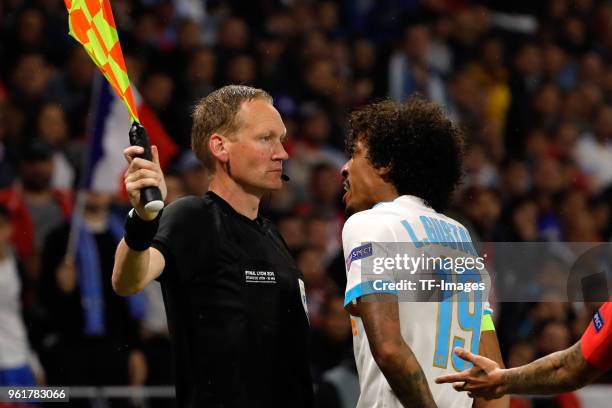 Luiz Gustavo of Marseille argues with the assistant referee during the UEFA Europa League Final between Olympique de Marseille and Club Atletico de...