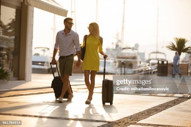 happy couple on a travel - suitcase couple stock pictures, royalty-free photos & images