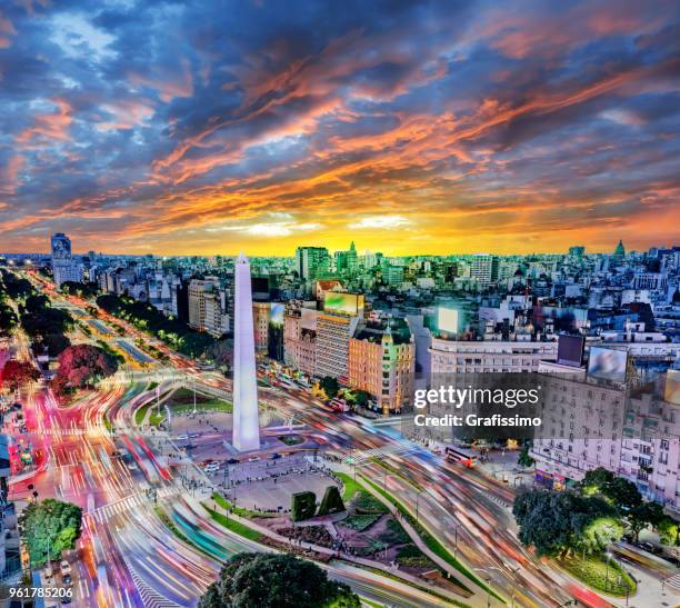 argentina buenos aires downtown with traffic cars at night arround the obelisco - buenos aires city stock pictures, royalty-free photos & images