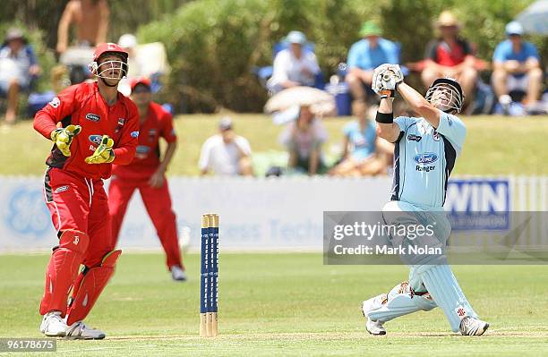 David Warner of the Blues hits a six during the Ford Ranger Cup match between the Blues and the Redbacks at North Dalton Park on January 26, 2010 in...