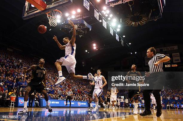 Xavier Henry of the Kansas Jayhawks is fouled as he goes up for a dunk on a fast break during the game against the Missouri Tigers on January 25,...