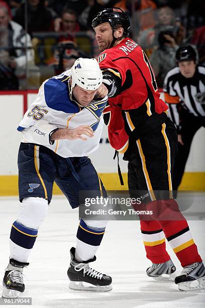 Brian McGrattan of the Calgary Flames fights Cam Janssen of the St. Louis Blues on January 25, 2010 at Pengrowth Saddledome in Calgary, Alberta,...