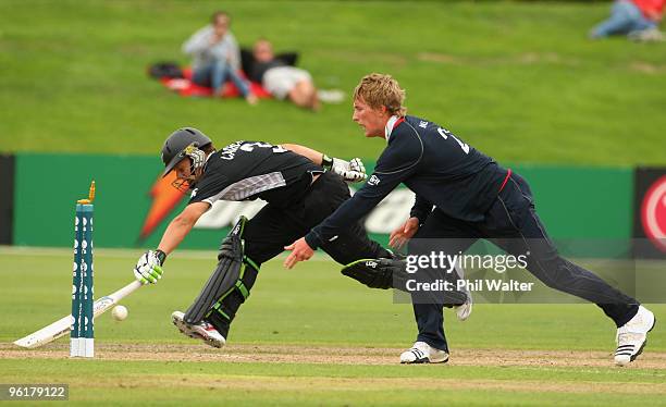 Adam Ball of England throws the ball at the stumps as Craig Cachopa of New Zealand makes his crease during the ICC U19 Cricket World Cup Super League...