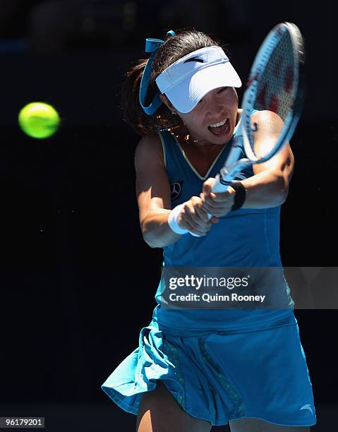 Jie Zheng of China plays a backhand in her quarterfinal match against Maria Kirilenko of Russia during day nine of the 2010 Australian Open at...