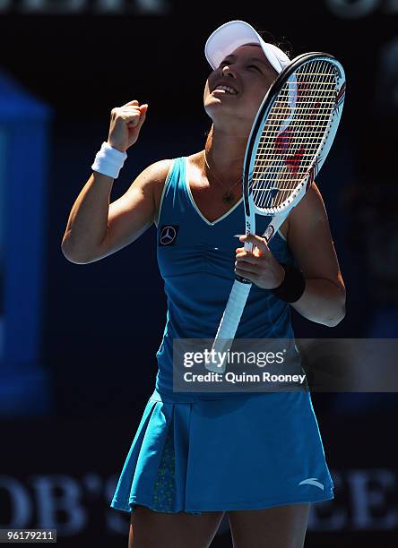 Jie Zheng of China celebrates winning match point in her quarterfinal match against Maria Kirilenko of Russia during day nine of the 2010 Australian...