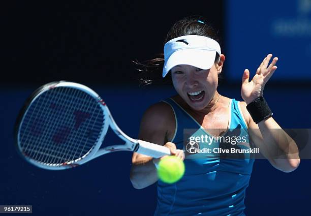 Jie Zheng of China plays a forehand in her quarterfinal match against Maria Kirilenko of Russia during day nine of the 2010 Australian Open at...