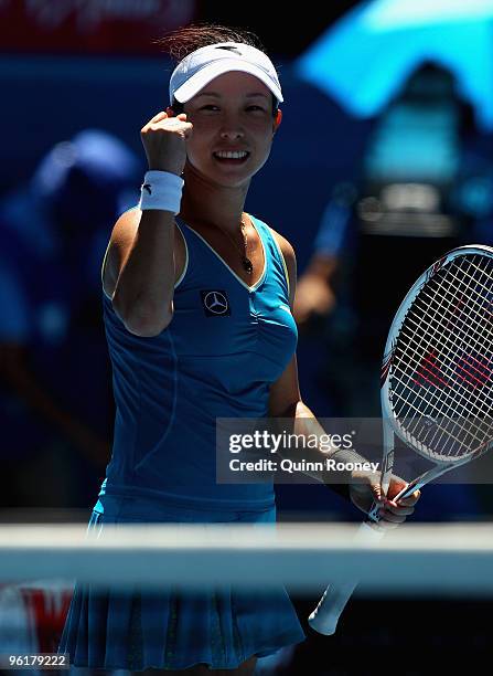 Jie Zheng of China celebrates winning match point in her quarterfinal match against Maria Kirilenko of Russia during day nine of the 2010 Australian...