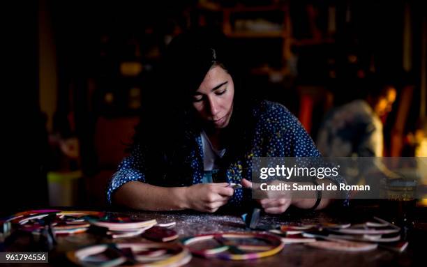 Laura Barroso Huber works the leather in his workshop. 'Cuero y Alma' Handicraft Made in Spain on April 26, 2018 in Madrid, Spain.