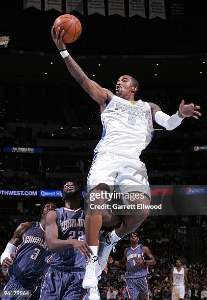 Smith of the Denver Nuggets goes to the basket against Ronald Murray of the Charlotte Bobcats on January 25, 2010 at the Pepsi Center in Denver,...