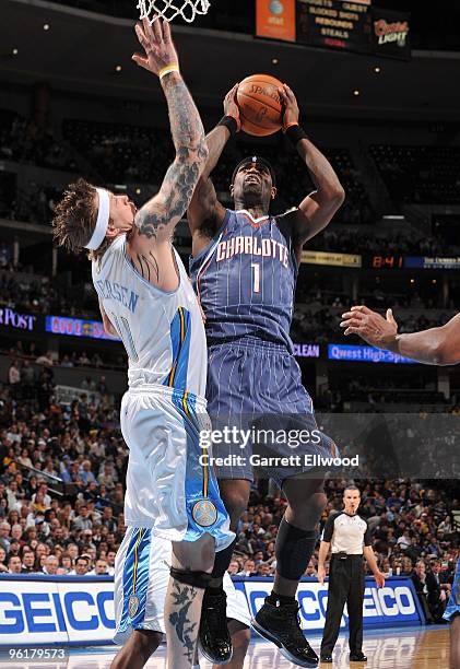 Stephen Jackson of the Charlotte Bobcats goes to the basket against Chris Andersen of the Denver Nuggets on January 25, 2010 at the Pepsi Center in...