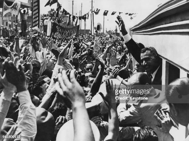 Egyptian President Gamal Abdel Nasser is cheered by crowds as he returns to Cairo after his speech in Alexandria announcing the nationalisation of...