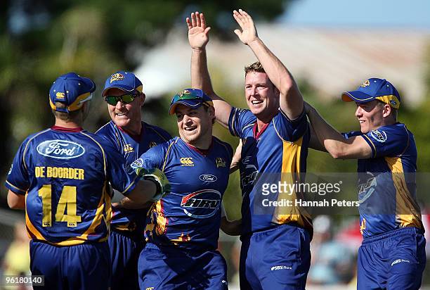 Ian Butler of Otago celebrates the wicket of Gareth Hopkins of Auckland during the HRV Cup Twenty20 match between the Auckland Aces and the Otago...