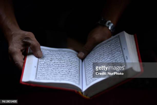 Nepalese Muslim reading Quran a holy book during the Ramadan celebrated in Nepali Jame mosque, Kathmandu, Nepal on Wednesday May 23, 2018. Ramadan is...