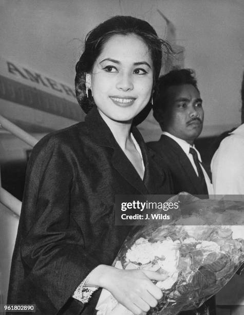 Ratna Sari Dewi Sukarno, the wife of Indonesian President Sukarno, arrives at London Airport on her first visit to London, 25th June 1965. She is in...