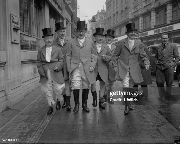 The Crazy Gang arrive at the Cafe de Paris in London for a luncheon for those taking part in the Royal Command Performance the following Monday, 9th...