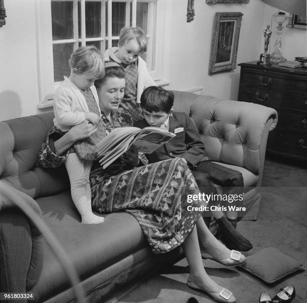 American actress Patricia Neal at home in Great Missenden, Buckinghamshire, with her children Lucy, Ophelia and Theo, 26th January 1968. The children...