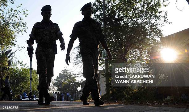 Sri Lanka Police Special Task Force commandos patrol in Tangalla, about 195 kms from the capital Colombo on January 26, 2010. Pre-dawn bomb blasts in...