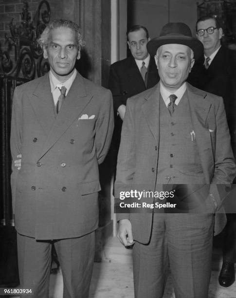 Krishna Menon , chief Indian delegate to the United Nations, and Jawaharlal Nehru , Prime Minister of India, leave 10 Downing Street in London after...