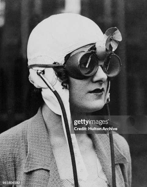 Racing driver Paddy Naismith wearing 'rain goggles', circa 1933. Invented by Mr L. A. C Davoran, the goggles are equipped with wipers powered by an...