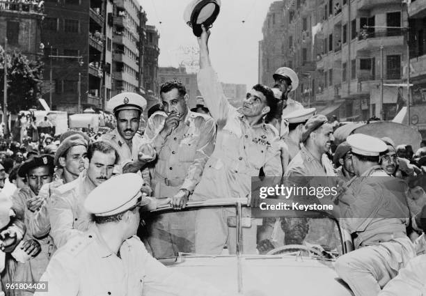 General Mohammed Naguib , the new President of Egypt, and Gamal Abdel Nasser ride through Cairo in a cavalcade celebrating Egypt's change of status...