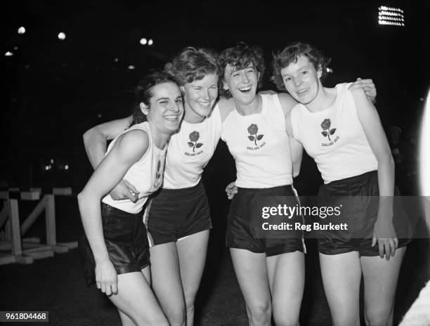 The British women's team after breaking the world record for the 4 x 220 yard relay at White City, London, 30th September 1953. They were competing...