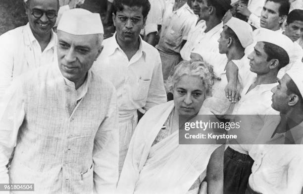 Jawaharlal Nehru and his sister Vijaya Lakshmi Pandit attend the Flag Salutation ceremony at the Azad Maidan in Bombay before the All India Congress...