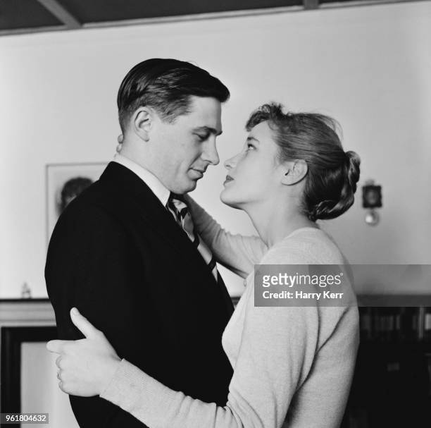 English actress Sylvia Syms with her husband Alan Edney, January 1957.
