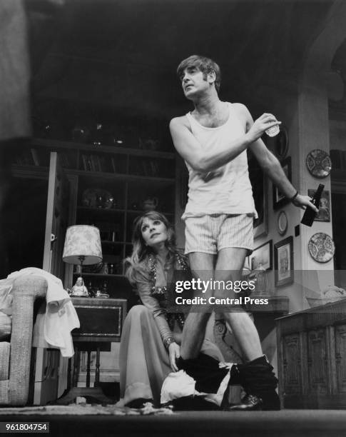 English actors Katy Manning and Derek Nimmo during rehearsals for the play 'Why Not Stay For Breakfast?', circa 1973.